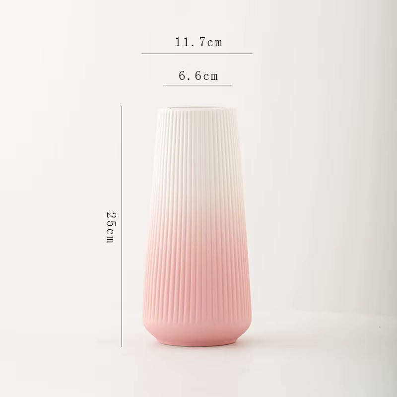 Pink and white gradient vase with dimensions on a light gray background