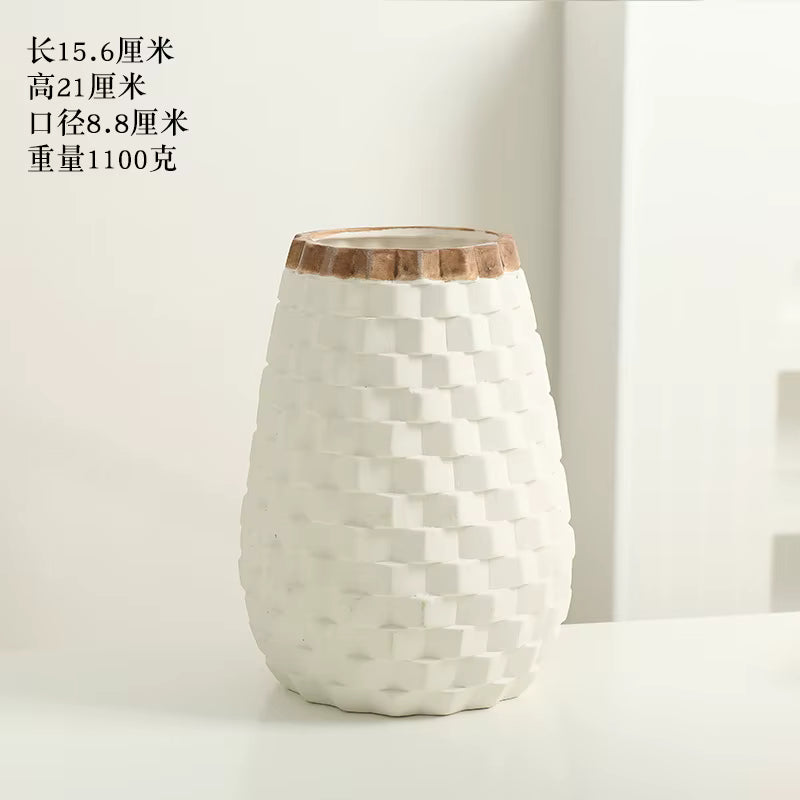 White textured vase with wooden rim on a white background