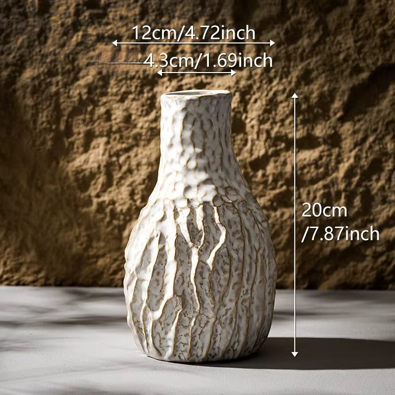 Ceramic vase with measurements against a textured wall background