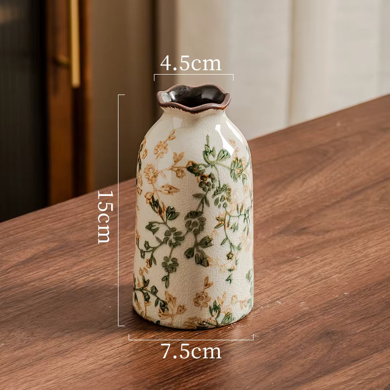 Decorative vase with floral patterns on a wooden surface, showing measurements.