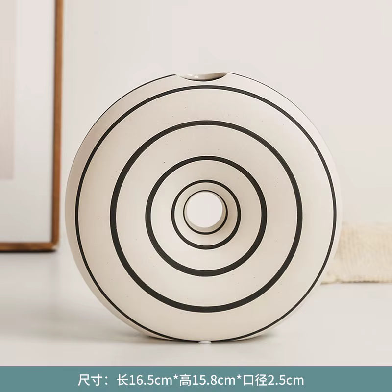 Round ceramic product with concentric circles on a light background