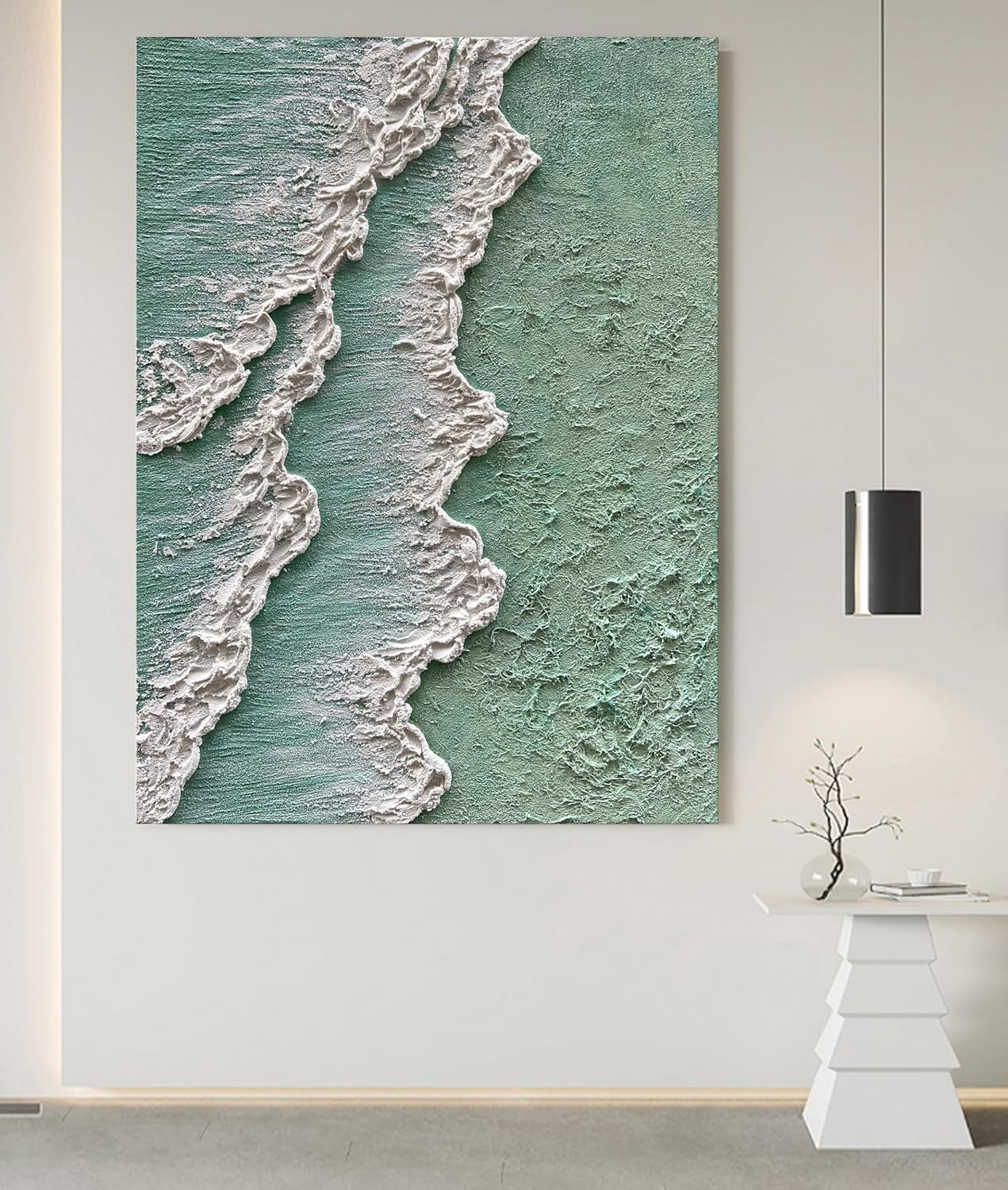 Wall art depicting ocean waves on a textured green background in a modern interior setting.