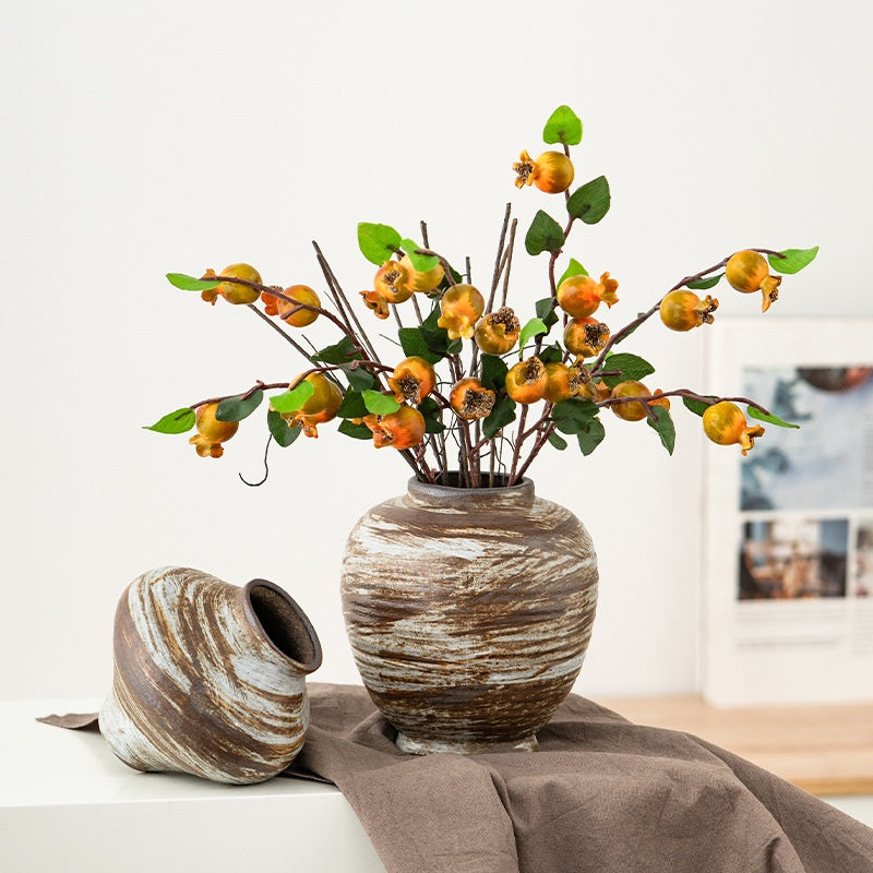 Decorative vase with artificial flowers on a table