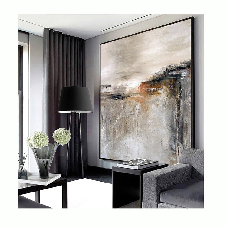 Modern living room with abstract art, gray sofa, and decorative elements.
