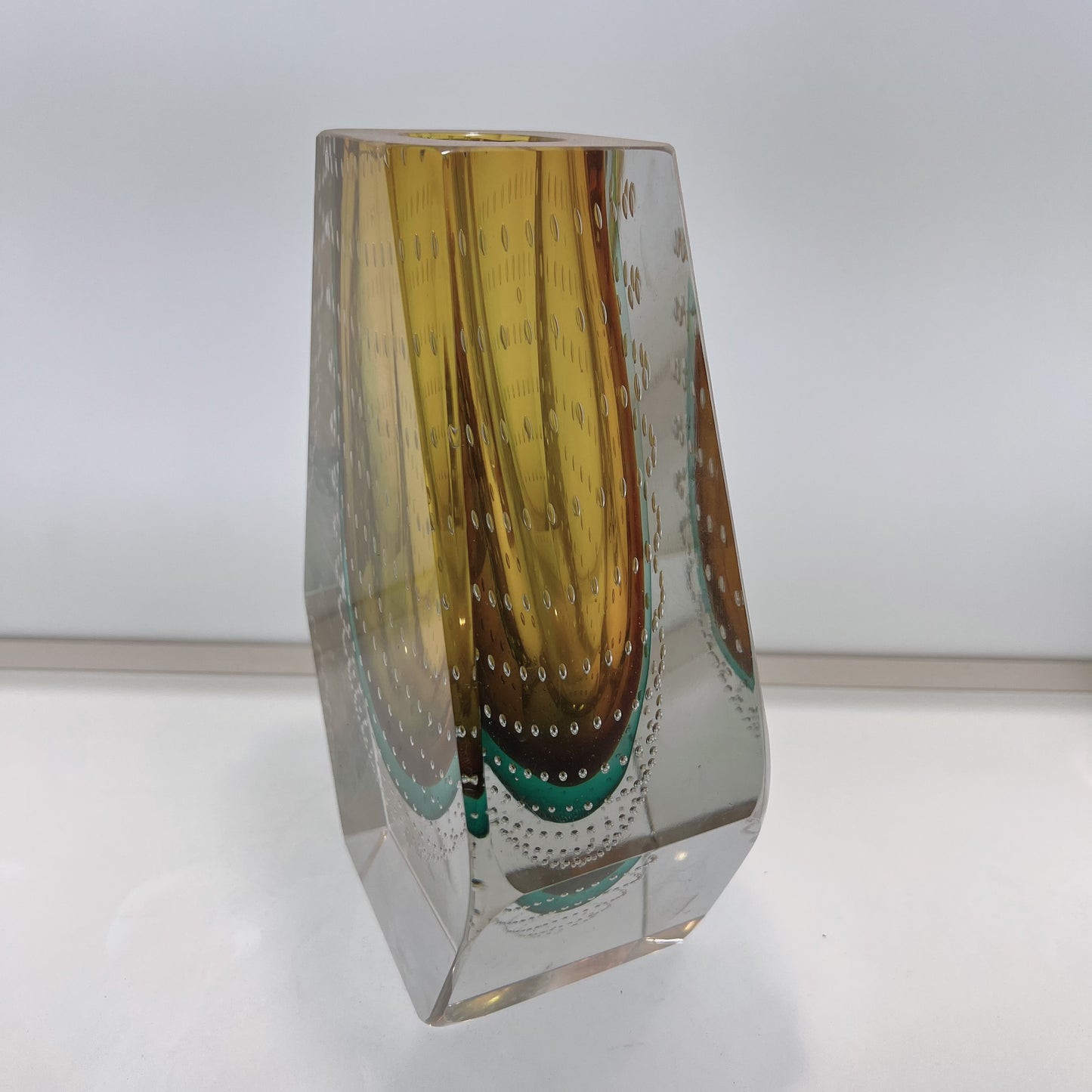 Glass vase with brown and clear design on a white background