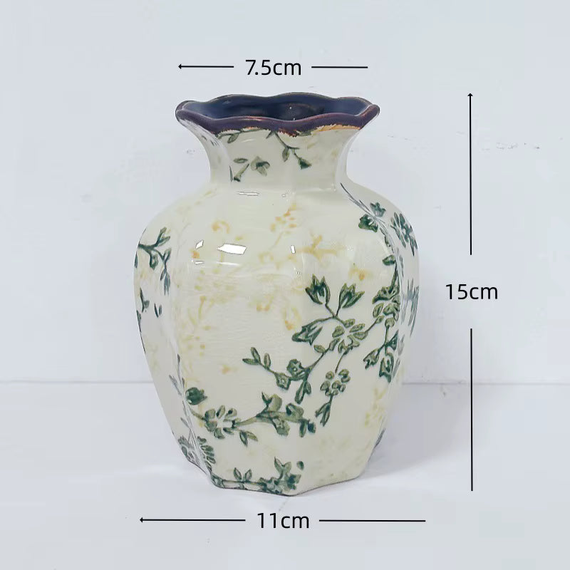 Ceramic vase with floral patterns and measurements on a white background