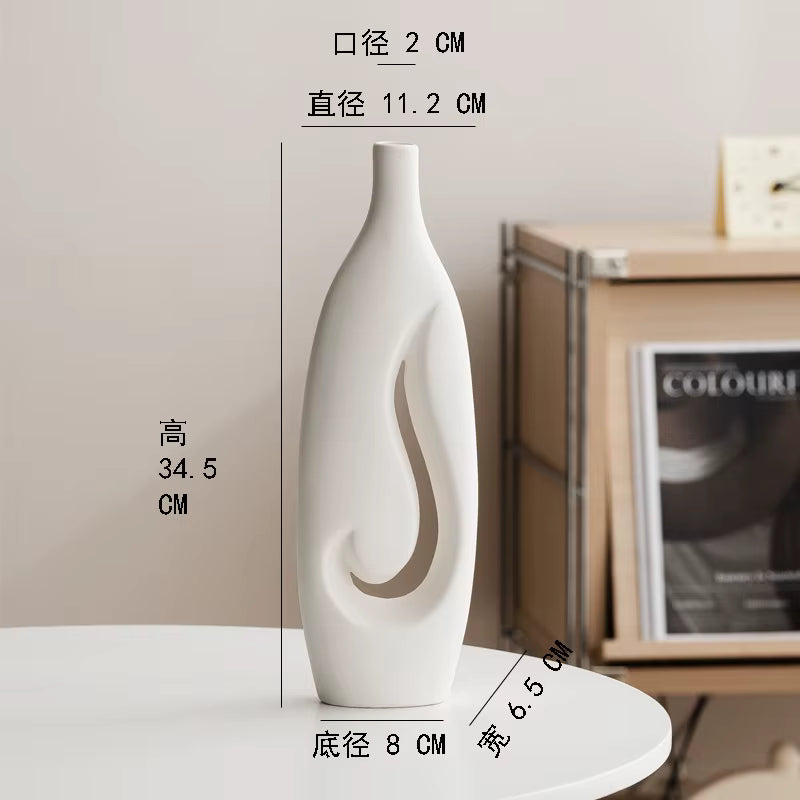White vase with measurements on a neutral background