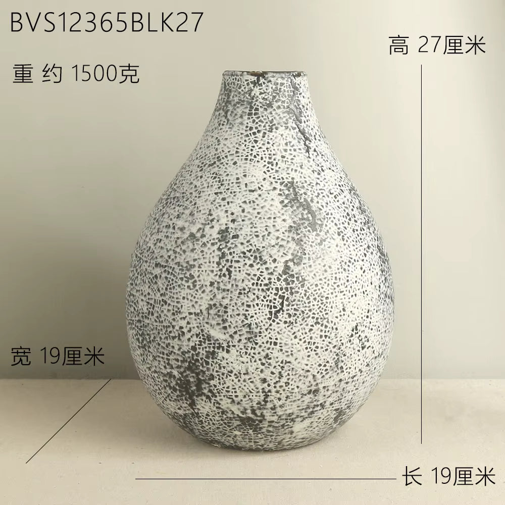 Speckled vase on a beige background with measurements indicated