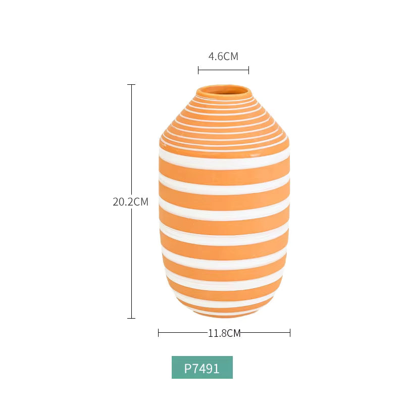 Striped orange and white vase with measurements on a white background