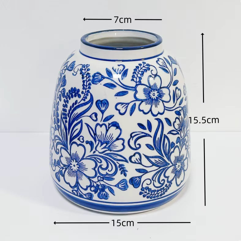Ceramic vase with blue floral patterns and measurements on a white background