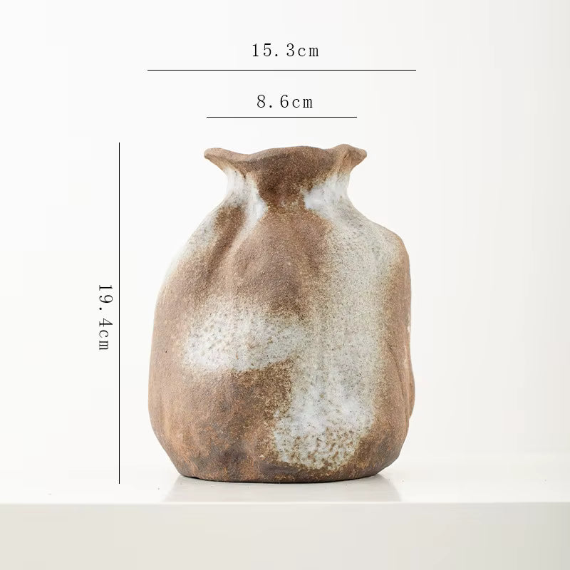 Ceramic vase with measurement details on a white background