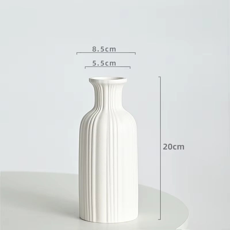 White vase with dimensions on a light gray background