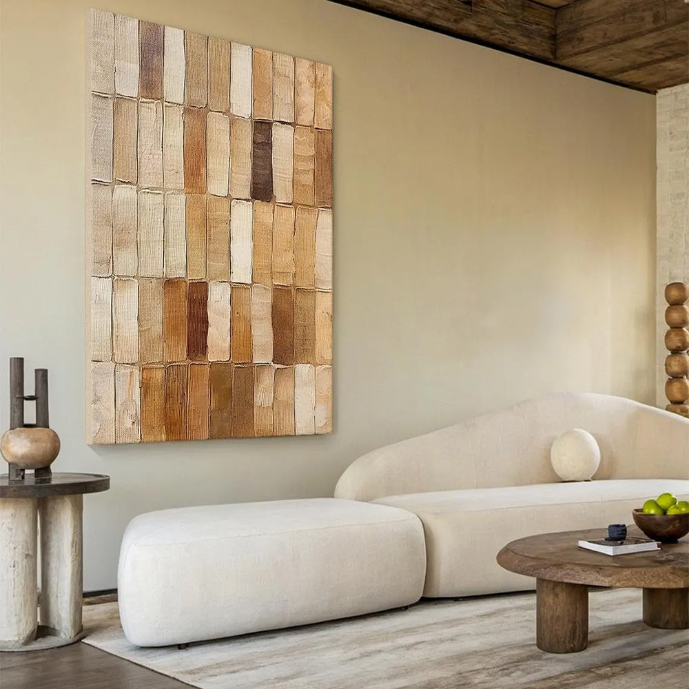 Modern living room with a wooden wall art piece and a beige sofa.