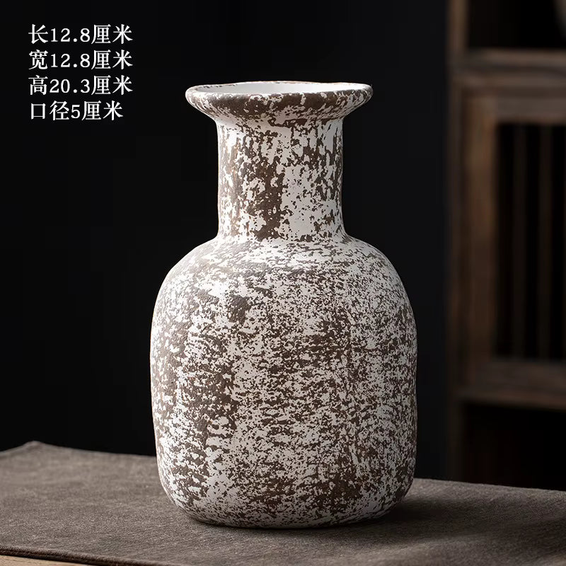 Decorative ceramic vase with textured surface on a dark background