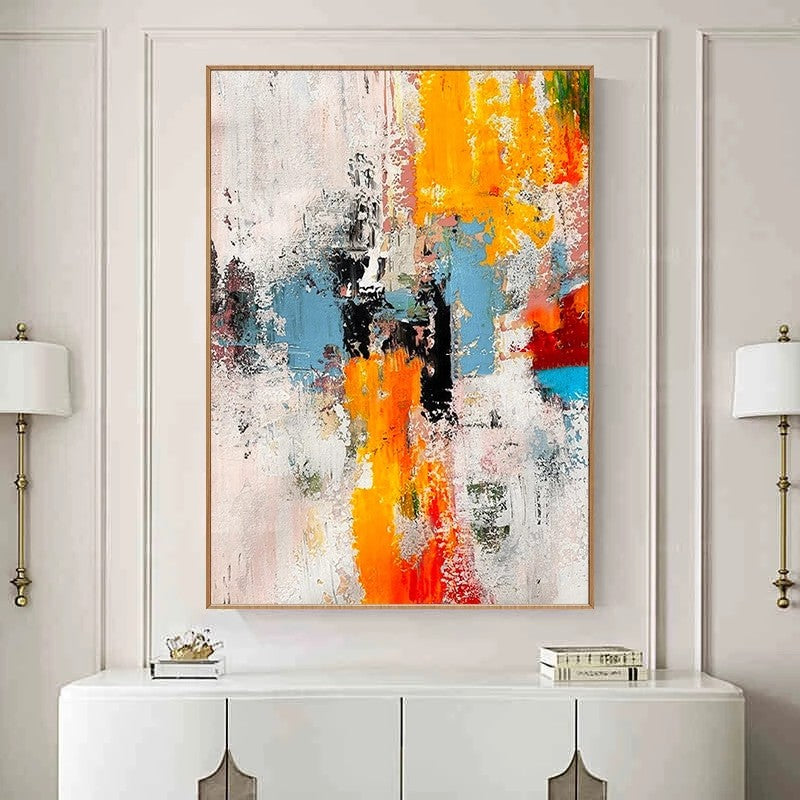 Abstract art painting with vibrant colors in a modern interior setting.