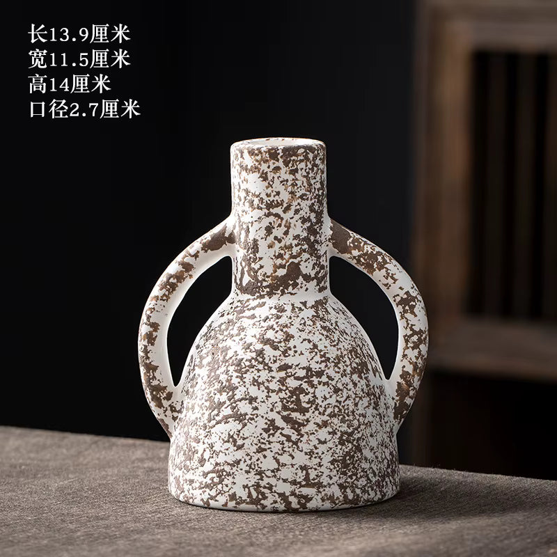 Ceramic vase with textured surface on a dark background