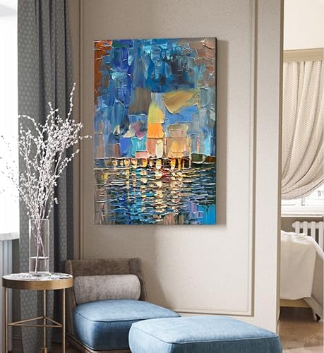 Abstract painting in a modern living room setting with a chair and side table.