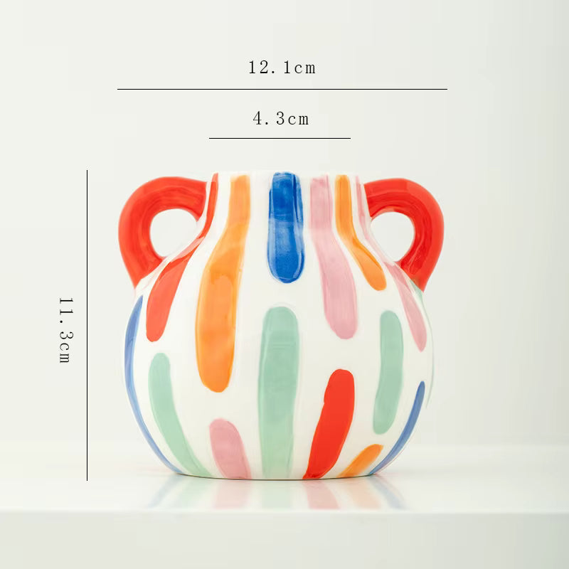 Colorful ceramic vase with dimensions on a white background