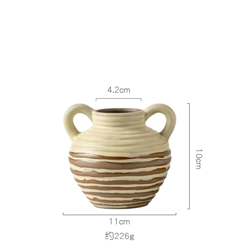 Ceramic vase with handles and dimensions on a white background