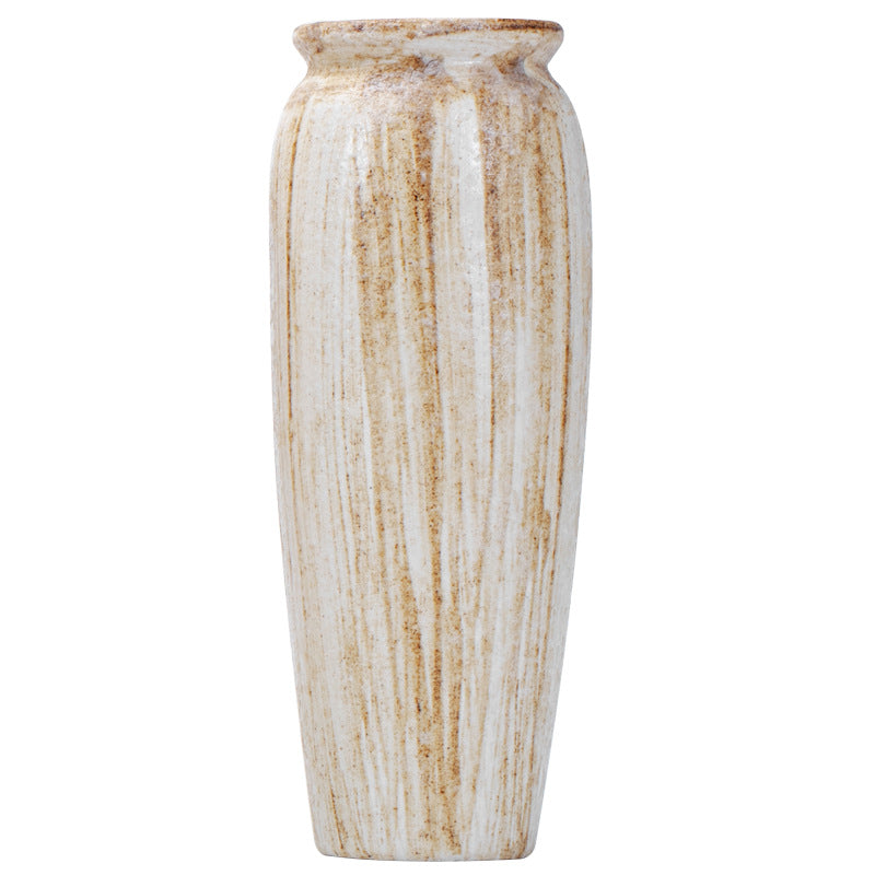 Decorative vase with a ribbed texture on a white background