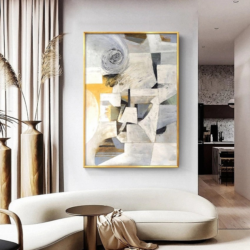 Modern living room with abstract art on the wall, white sofa, and decorative elements.
