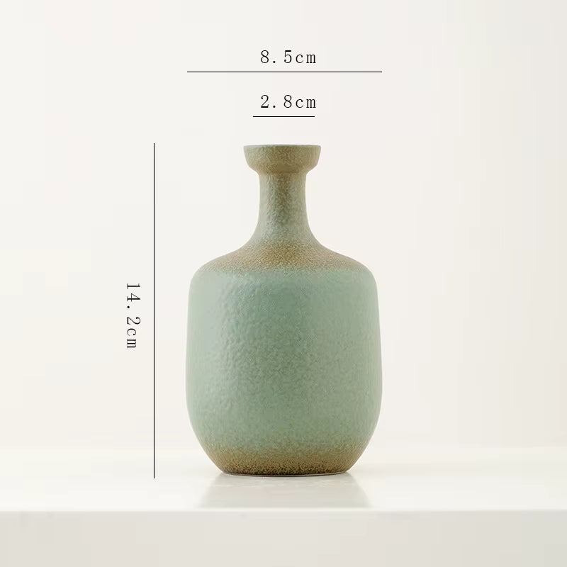 Green ceramic vase with dimensions on a white background