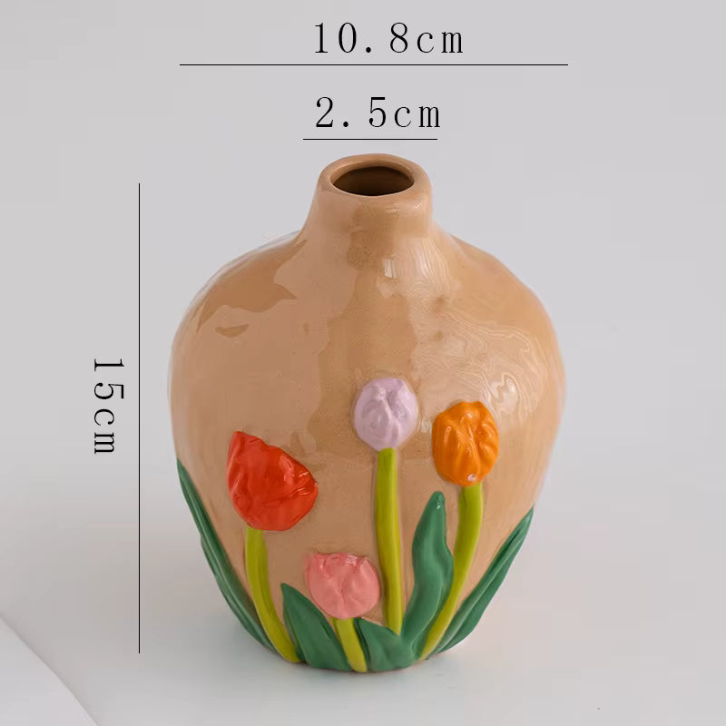 Ceramic vase with floral design and measurements on a white background
