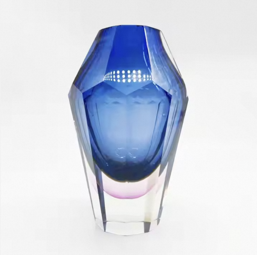 Blue glass vase on a white background