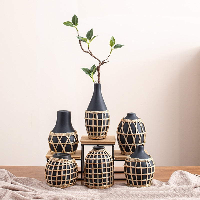 Set of decorative vases with woven patterns on a neutral background