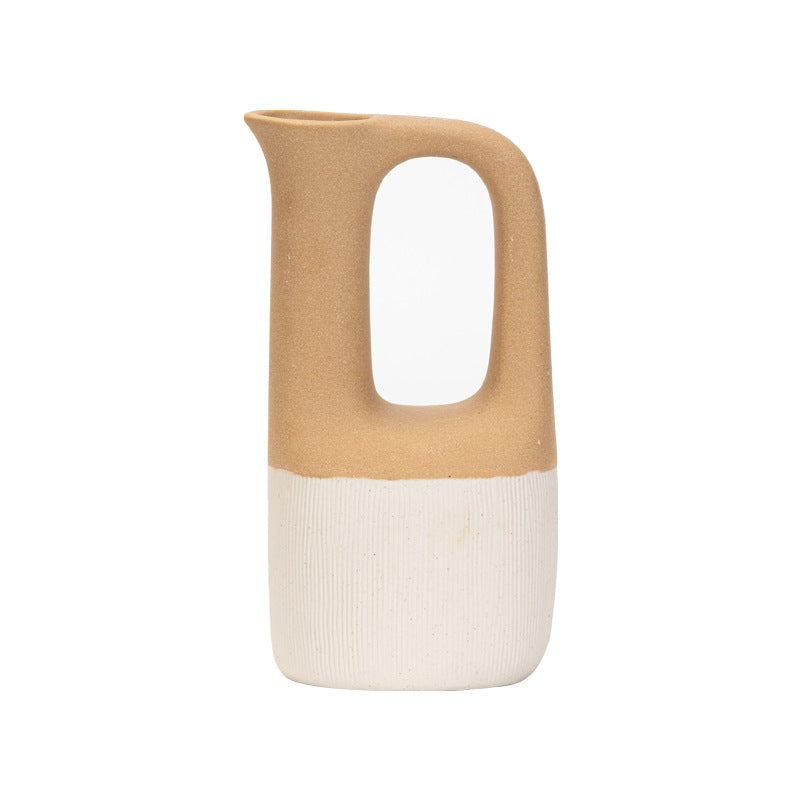 Ceramic pitcher with two-tone design on a white background