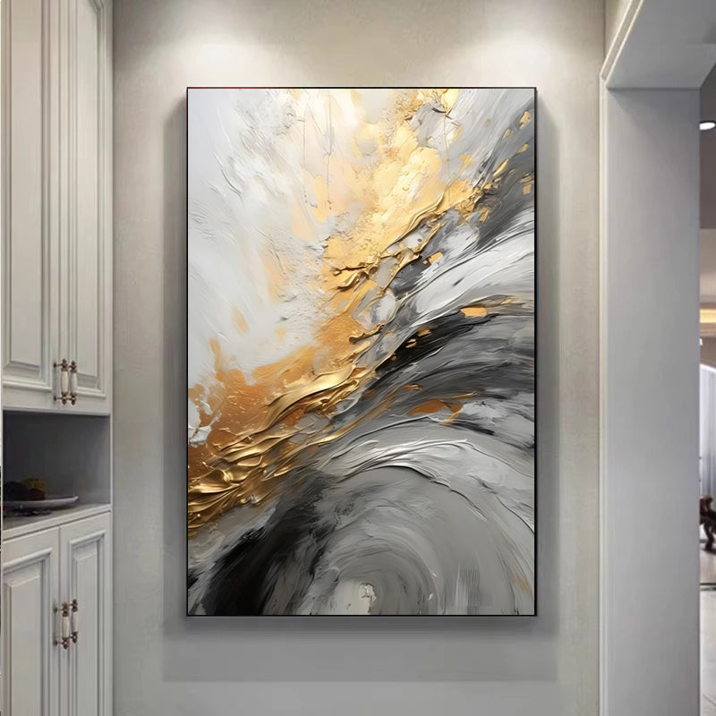 Abstract art painting with gold and gray tones on a wall in a modern interior setting.