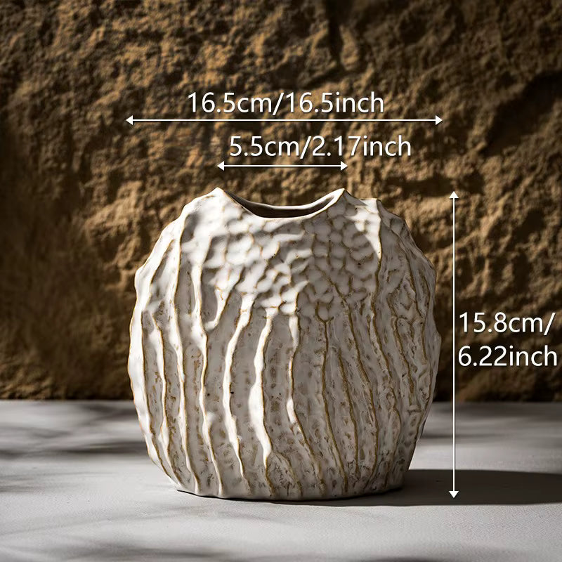 Ceramic vase with textured surface and measurements indicated on a neutral background