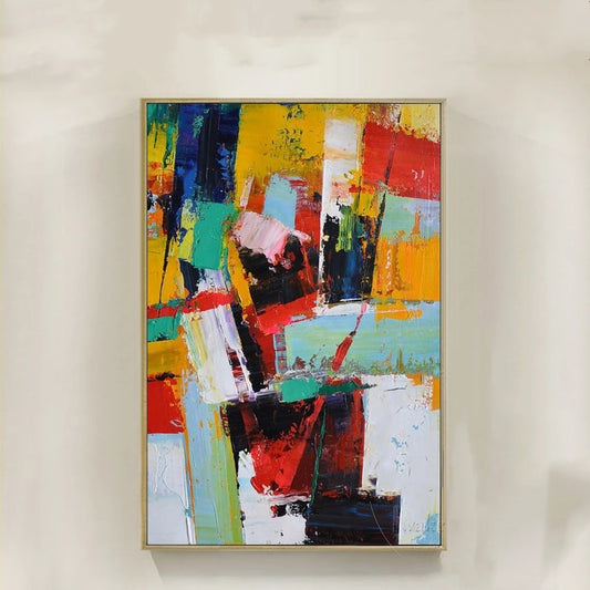 Abstract painting with colorful blocks on a white wall