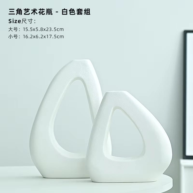 Two white ceramic vases on a light gray background with text displaying dimensions.