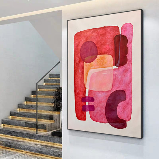 Abstract art piece on a wall next to a staircase