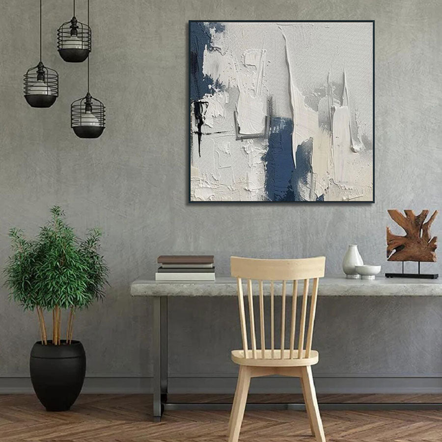 Modern interior with abstract art, table, chair, and plants.