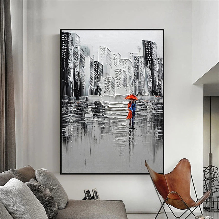 Framed artwork of a cityscape with two people holding an umbrella in a modern living room.