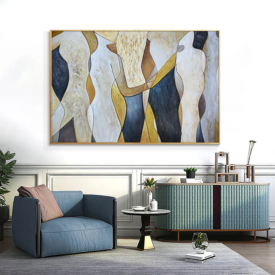 Modern living room with abstract art on the wall, blue armchair, and decorative items.