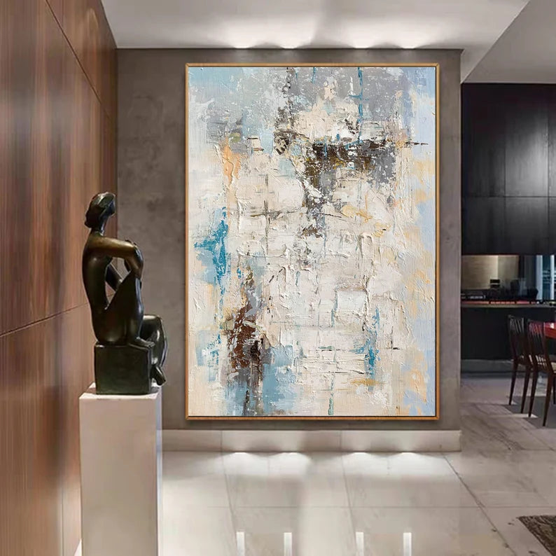 Abstract painting in a modern interior setting with a sculpture on a pedestal.