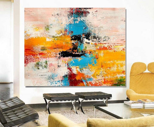 Modern living room with a colorful abstract painting on the wall.