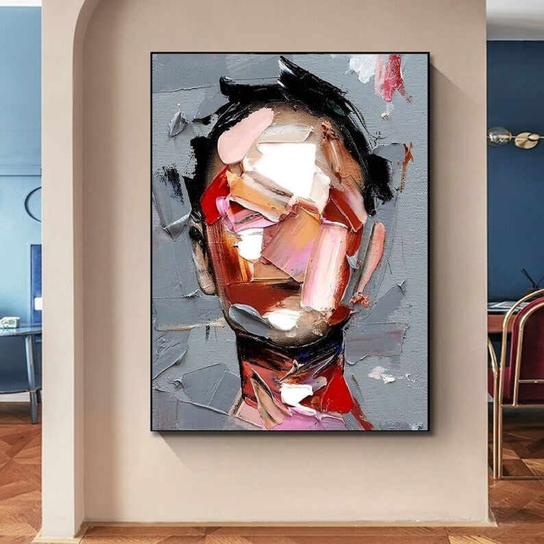 Abstract art painting on a wall in a modern interior setting