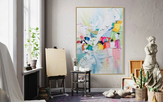 Colorful abstract painting on a wall in a room with decor elements.
