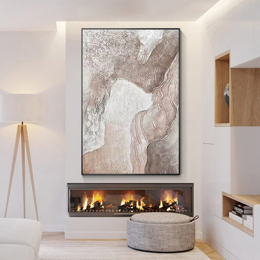 Modern living room with a fireplace, abstract wall art, and a lamp.