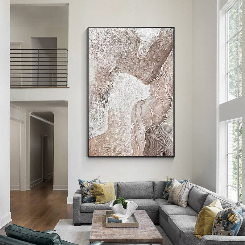 Living room with a large abstract painting on the wall above a sectional sofa.