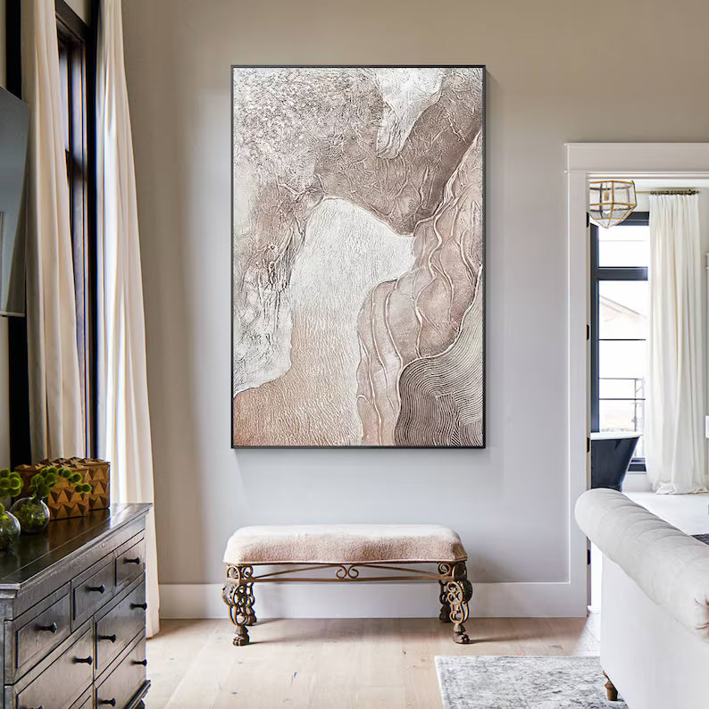 Living room with abstract art on the wall, bench, and furniture.