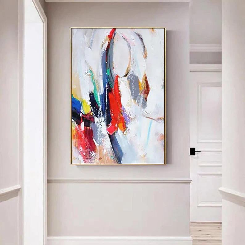 Abstract painting with colorful circles on a wall in a modern interior setting