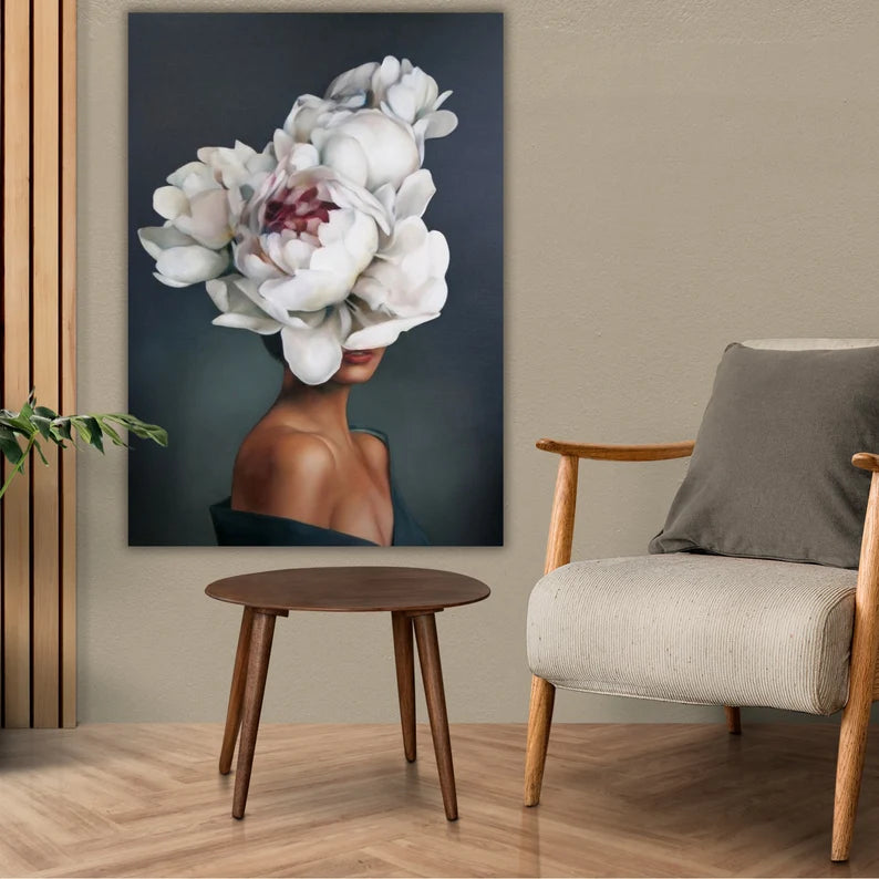Room interior with a chair, table, and wall art featuring a floral design.