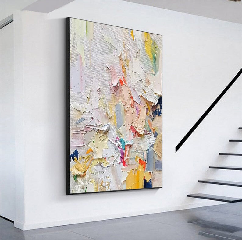 Abstract painting on a wall in a modern interior setting with stairs.
