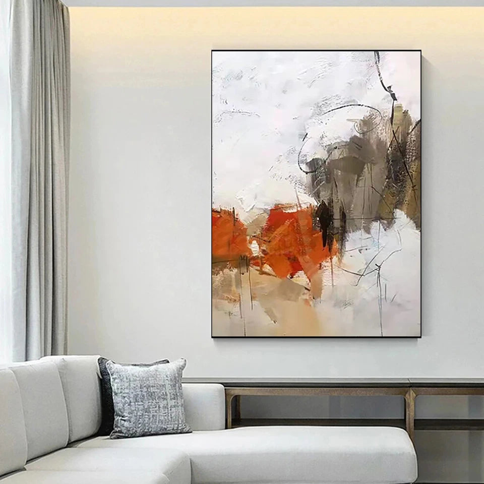 Abstract art painting in a living room with a white sofa and light gray walls.