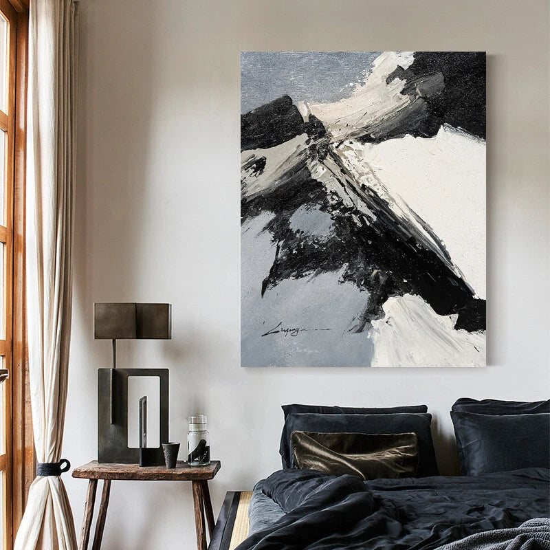 Abstract painting on a wall above a bed in a bedroom setting